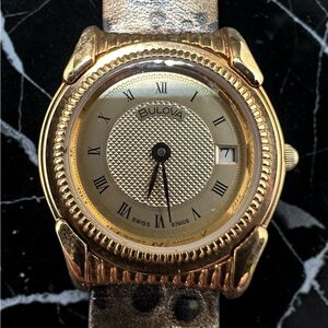 Bulova Gold Tone Round Watch with Champagne Dial. Unused. New, old stock.